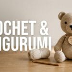 A beautiful crochet teddy bear sitting securely on a desk next to bold typography reading CROCHET & AMIGURUMI.