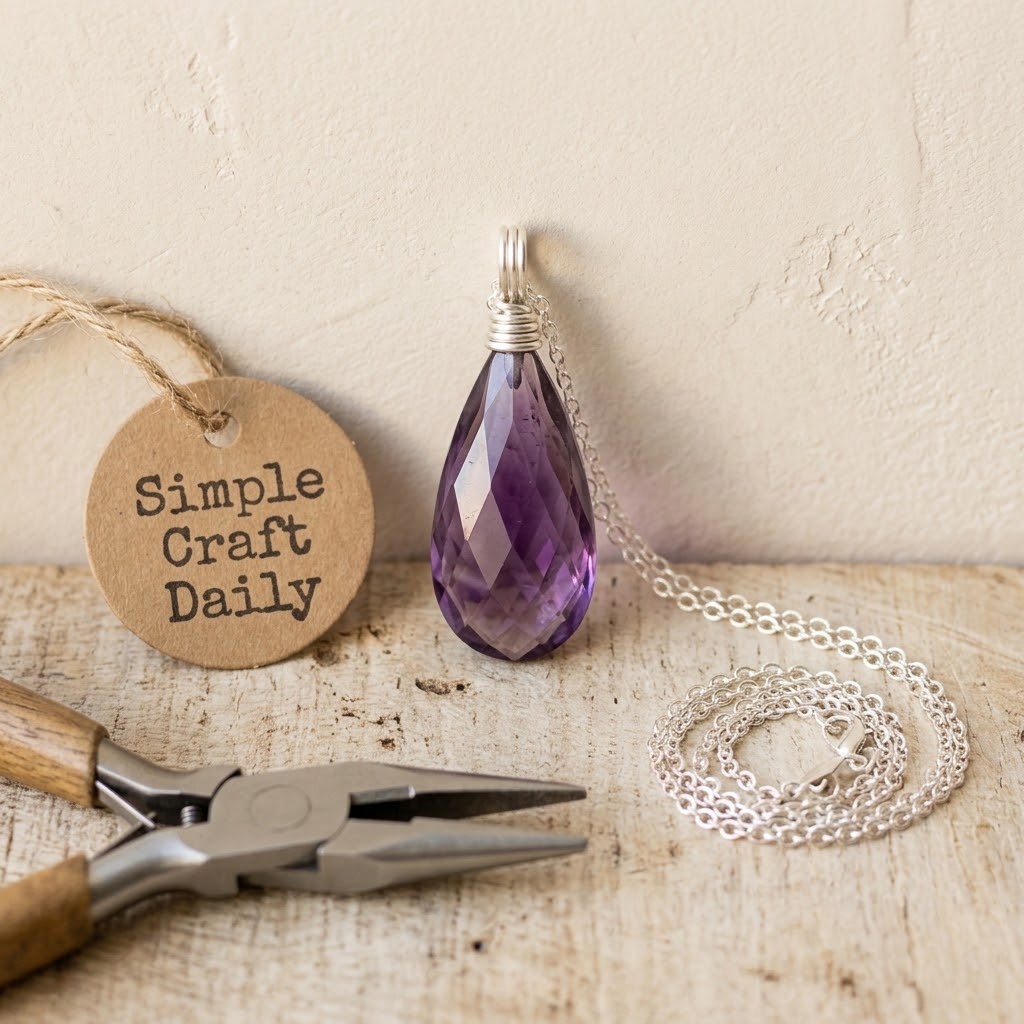 DIY wire wrap pendant with faceted amethyst briolette and silver wrapped loop